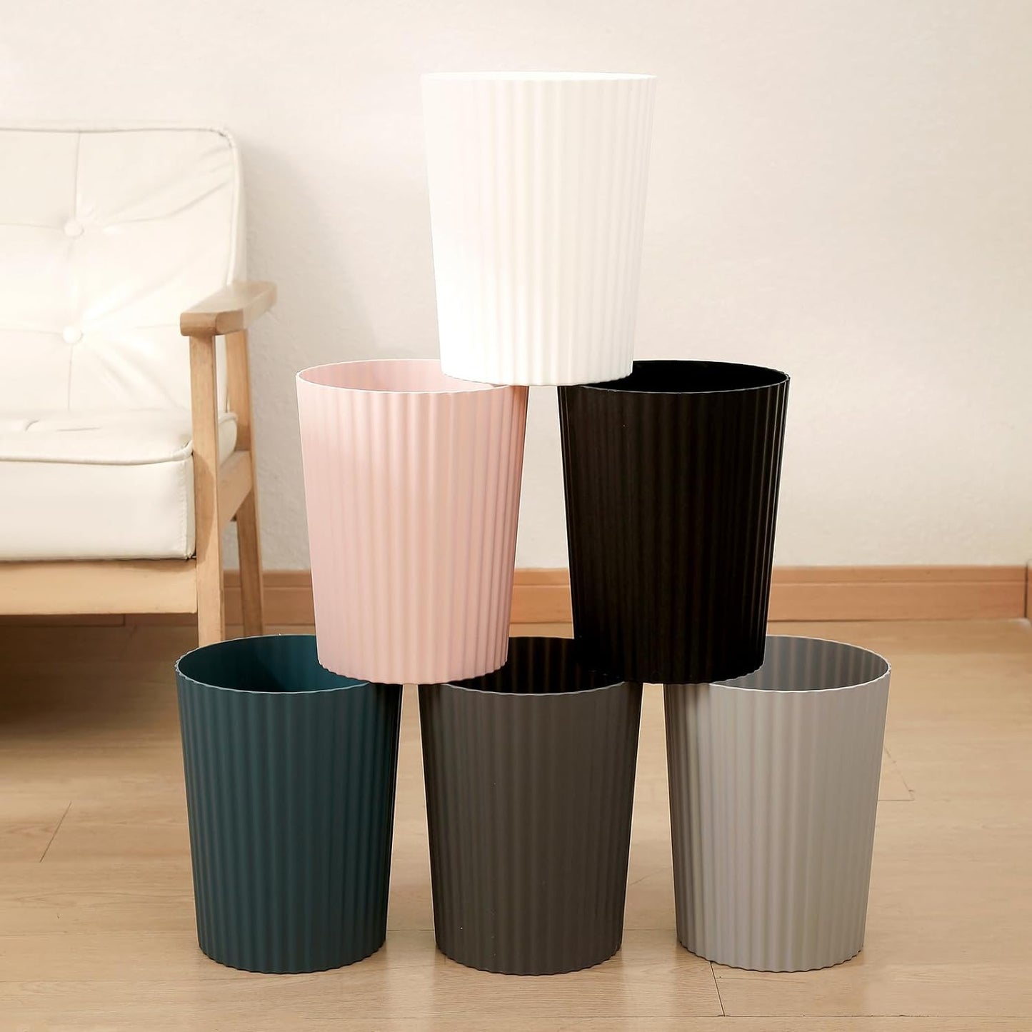 Pink small round plastic wastebasket, view 4