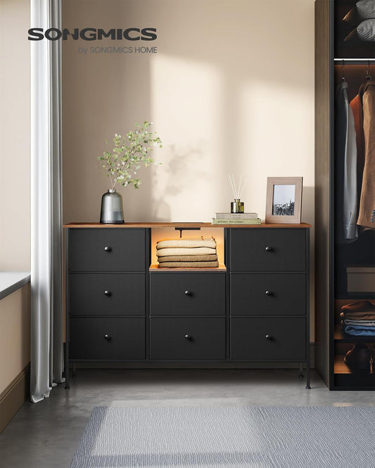 Dresser for Bedroom, Fabric Dresser with Power Outlets and LED Lights, TV Stand for up to 60 Inch Tvs, 25 Colors, 11.8 X 47.2 X 31.3 Inches, Ink Black and Rustic Brown ULTS518B01