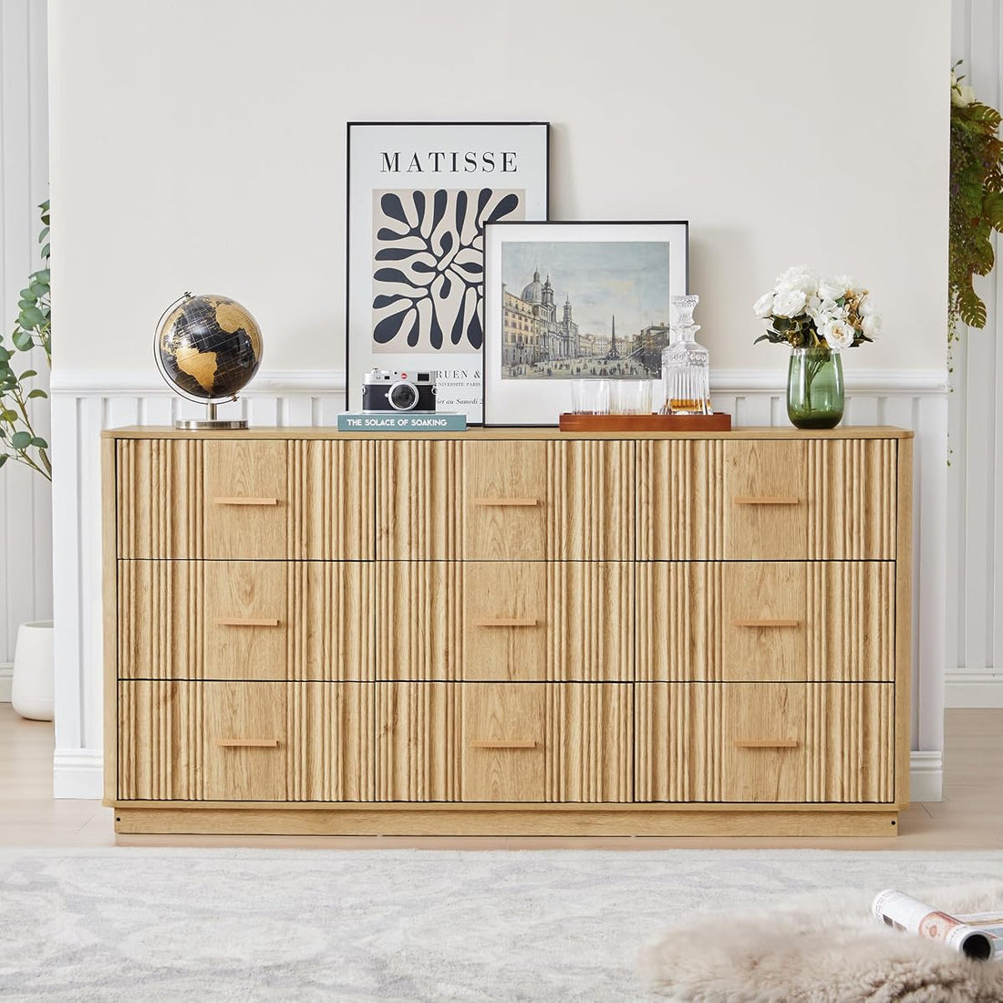 Natural oak fluted 9 drawer dresser, 59 inches wide, in a bedroom