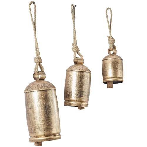 Deco 79 Metal Cow Bells, Meditation Bell, Set of 3, 10", 7", 5"H, Gold Gold | Indoor metal art Tibetan inspired decorative cow bells with jute hanging rope, living room wall decor