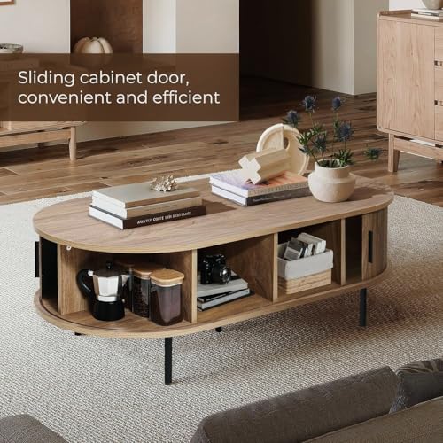 LuxenHome 47" Oval Coffee Table with Storage and Sliding Door | mid century modern style, fluted sliding door, hidden storage space, metal legs