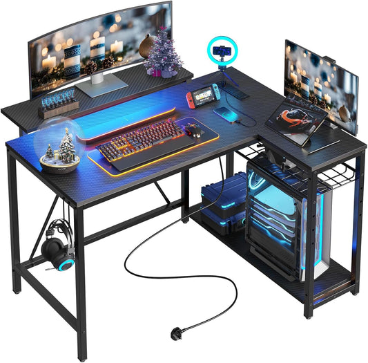 Gaming Desk with Power Outlets, 42" L-Shaped Computer Desk with LED Lights, Desk with Reversible Storage Shelves & Hooks for Small Spaces, Bedrooms & Offices, Black Carbon Fiber
