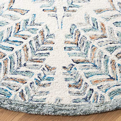 SAFAVIEH Capri Collection Area Rug - 9' Round, Ivory & Blue, Handmade Wool, Ideal for High Traffic Areas in Living Room, Bedroom (CPR208A)