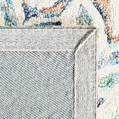 SAFAVIEH Capri Collection Area Rug - 9' Round, Ivory & Blue, Handmade Wool, Ideal for High Traffic Areas in Living Room, Bedroom (CPR208A)