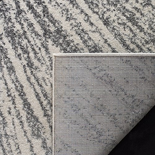 SAFAVIEH Evoke Collection Area Rug - 9' x 12', Black & Ivory, Abstract Burst Design, Non-Shedding & Easy Care, Ideal for High Traffic Areas in Living Room, Bedroom (EVK228K)