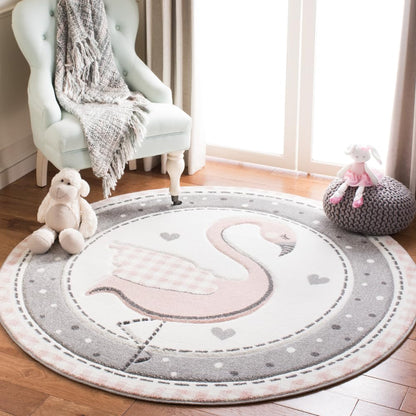 SAFAVIEH Carousel Kids Collection Area Rug - 5'3" Round, Pink & Ivory, Non-Shedding & Easy Care, Ideal for High Traffic Areas for Boys & Girls in Playroom, Nursery, Bedroom (CRK154P)