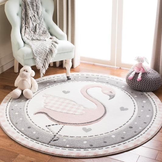 SAFAVIEH Carousel Kids Collection Area Rug - 5'3" Round, Pink & Ivory, Non-Shedding & Easy Care, Ideal for High Traffic Areas for Boys & Girls in Playroom, Nursery, Bedroom (CRK154P)