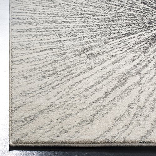 SAFAVIEH Evoke Collection Area Rug - 9' x 12', Black & Ivory, Abstract Burst Design, Non-Shedding & Easy Care, Ideal for High Traffic Areas in Living Room, Bedroom (EVK228K)