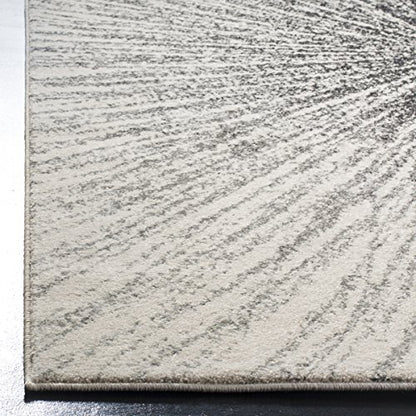 SAFAVIEH Evoke Collection Area Rug - 9' x 12', Black & Ivory, Abstract Burst Design, Non-Shedding & Easy Care, Ideal for High Traffic Areas in Living Room, Bedroom (EVK228K)