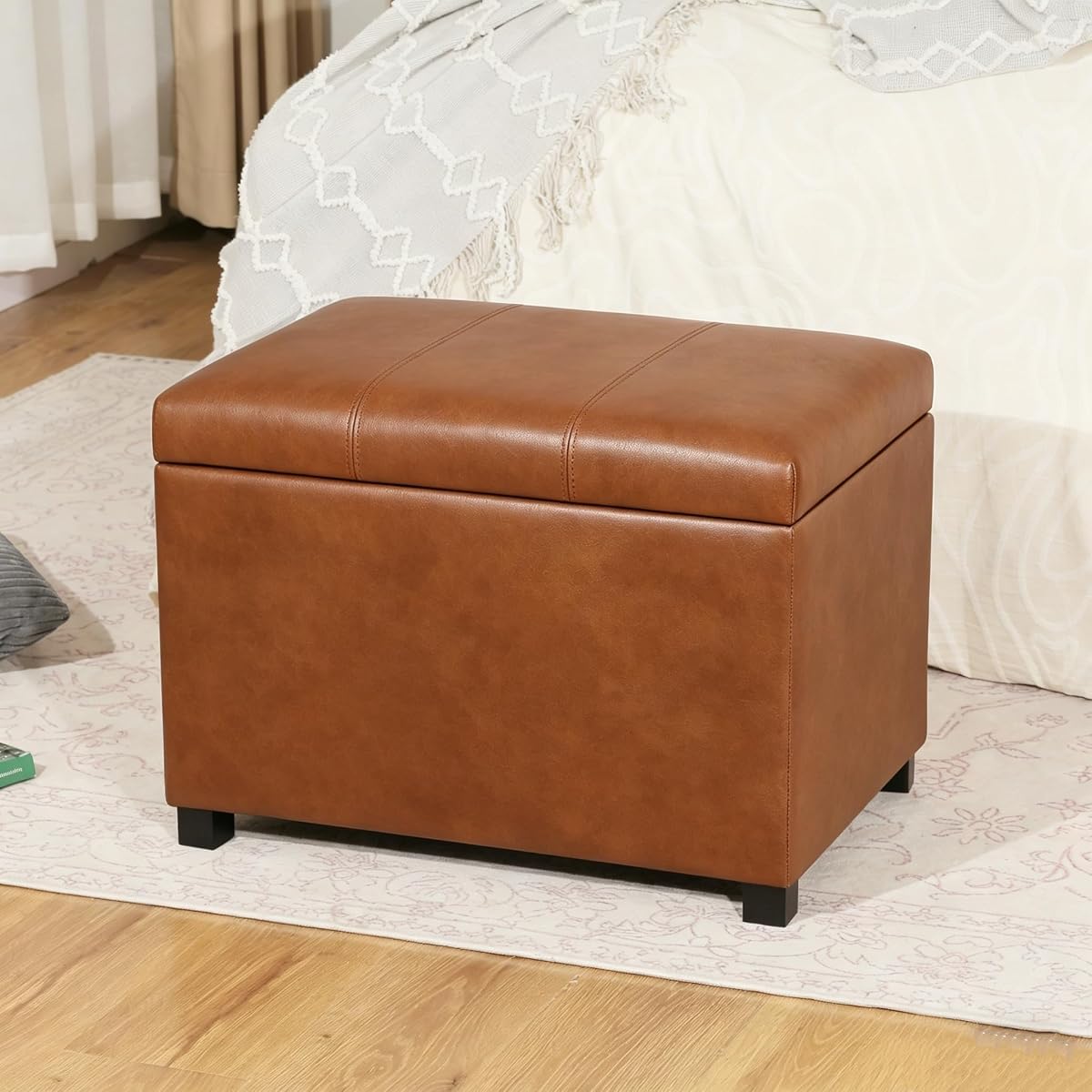 24-Inch Storage Ottoman Bench,Foot Stool Ottoman with Storage, Faux Leather Upholstered Foot Rest Seat with Safety Hinge,Wood Legs Stool for Living Room, Bedroom,Entryway, Cognac Brown