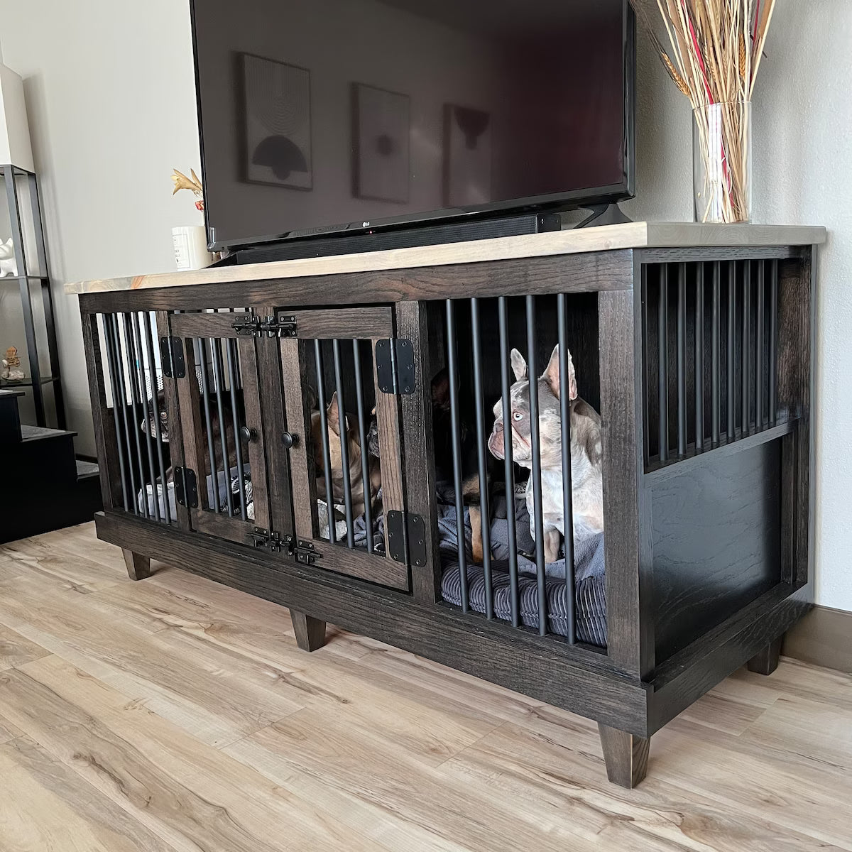 Wooden pet crate with a cat inside in a living room setting.