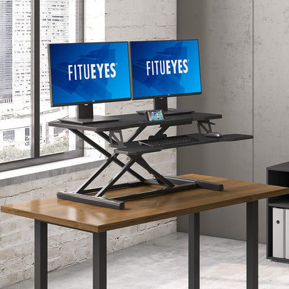 Black sit to stand desk converter for laptops and dual monitors, view 5