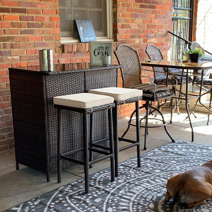 3Pcs Outdoor Bar Set, Patio Wicker Bar Furniture with 2 Storage Shelves, Glass Top Table, Cushions and Two Stools, Brown/Khaki