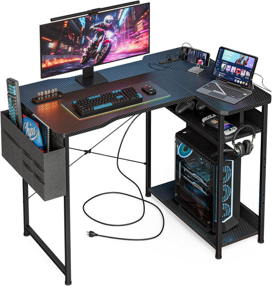 Small Gaming Desk with Power Outlets, 40 Inch L Shaped Desks with Reversible Shelves and Storage Bag,Computer Desk Corner Desk PC Desk for Gaming and Home Office Table,Black Carbon