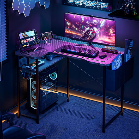 Small Gaming Desk with Power Outlets, 40 Inch L Shaped Desks with Reversible Shelves and Storage Bag,Computer Desk Corner Desk PC Desk for Gaming and Home Office Table,Black Carbon