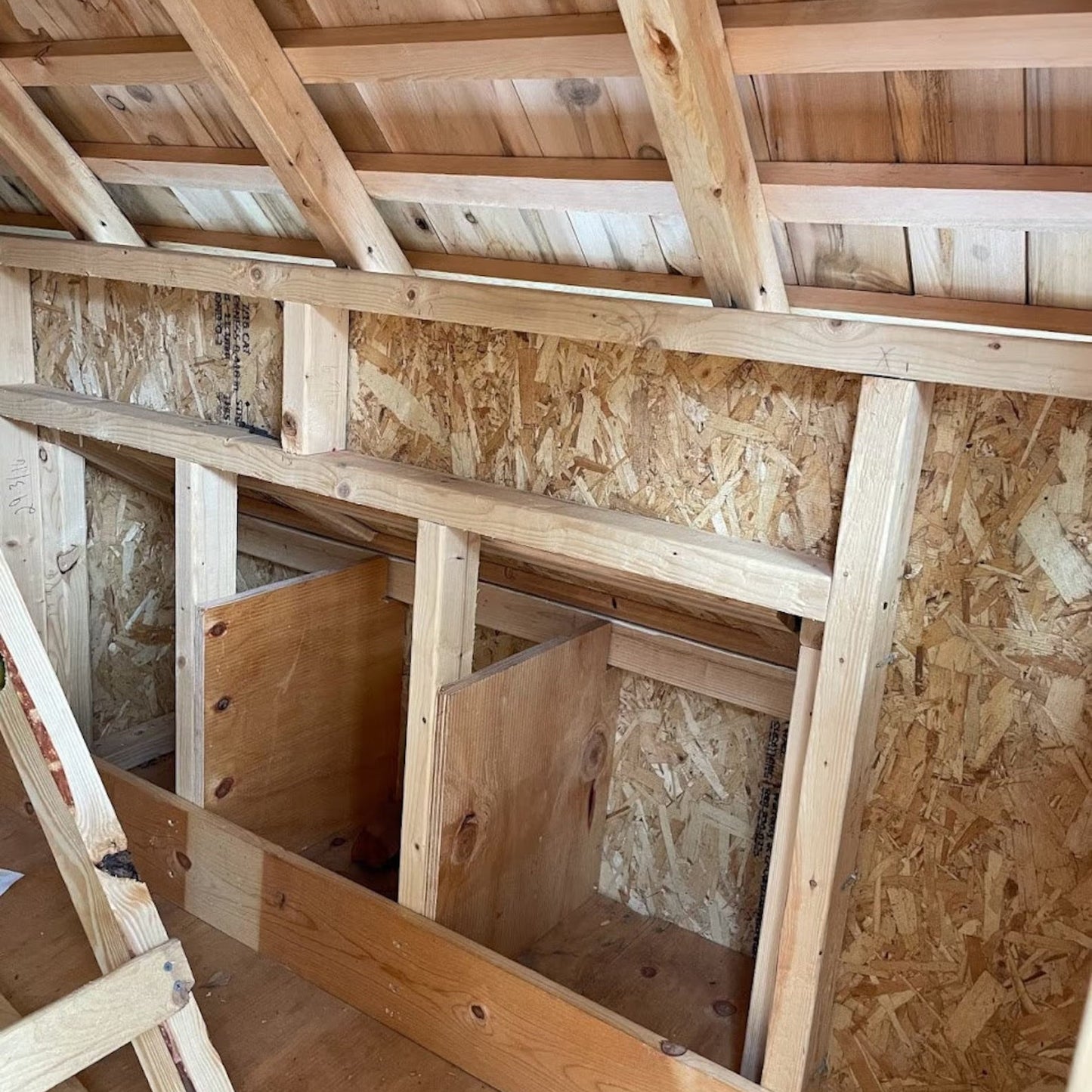 Wooden attic with insulation and exposed beams