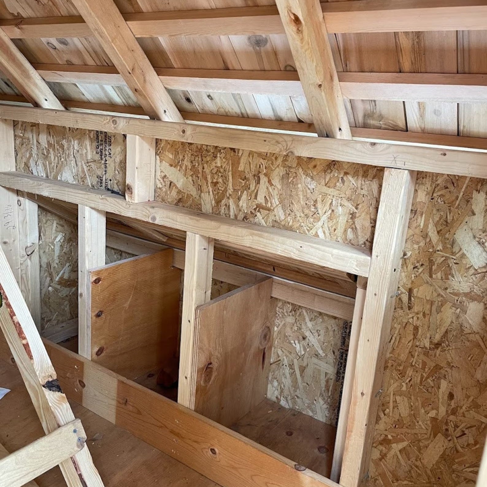 Wooden attic with insulation and exposed beams